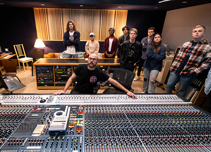 A Sonark Media's studio, music production students watch house engineer,Eli Webb demonstrate the 60-channel Neve 88R mixing board originally built for Electric Lady Studio in New York. (Jon Gardiner/UNC-Chapel Hill)