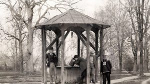 Young men pose in 1892 at what simply know as the well, while one fellow chugs from the bucket. (From Kemp Plummer Battle Photograph Album, #P0100, North Carolina Collection Photographic Archives, Wilson Library, UNC-Chapel Hill.