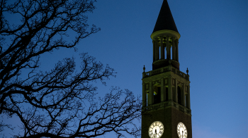 Nighttime view of a bell tower on the campus of UNC-Chapel Hill.