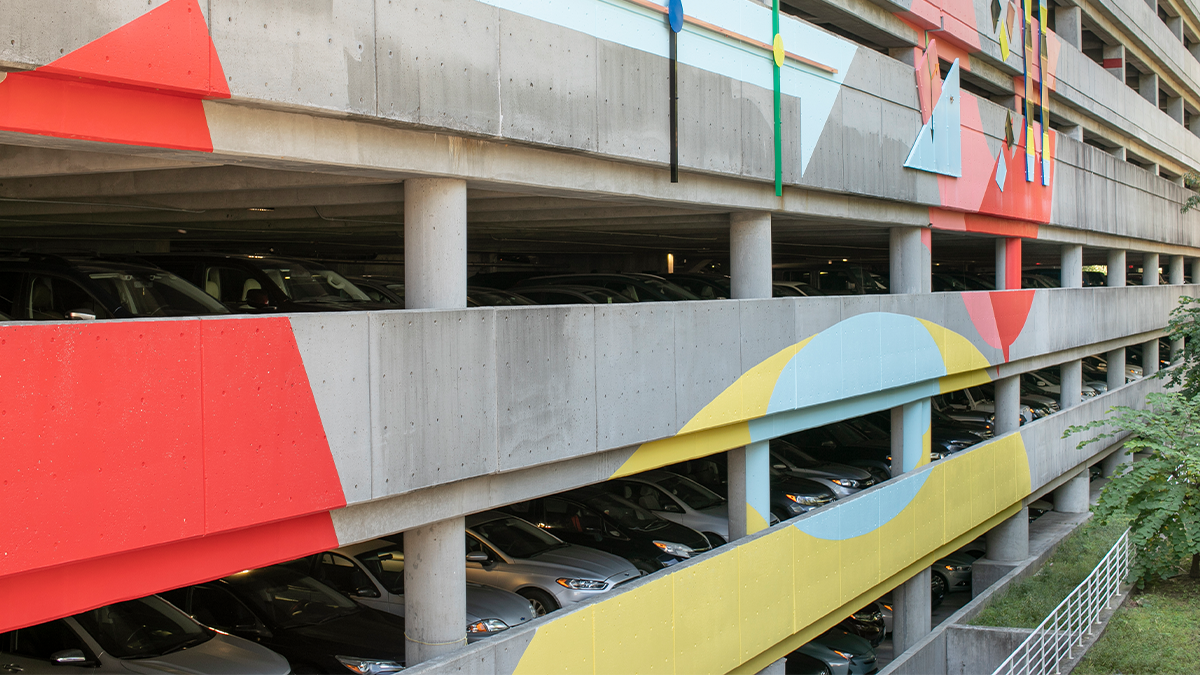 A parking deck with an art installation on its exterior.
