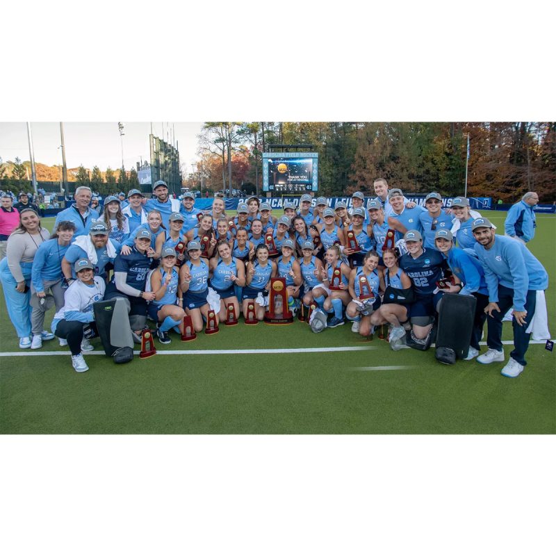 The Carolina field hockey team taking a group photo after winning the national championship.