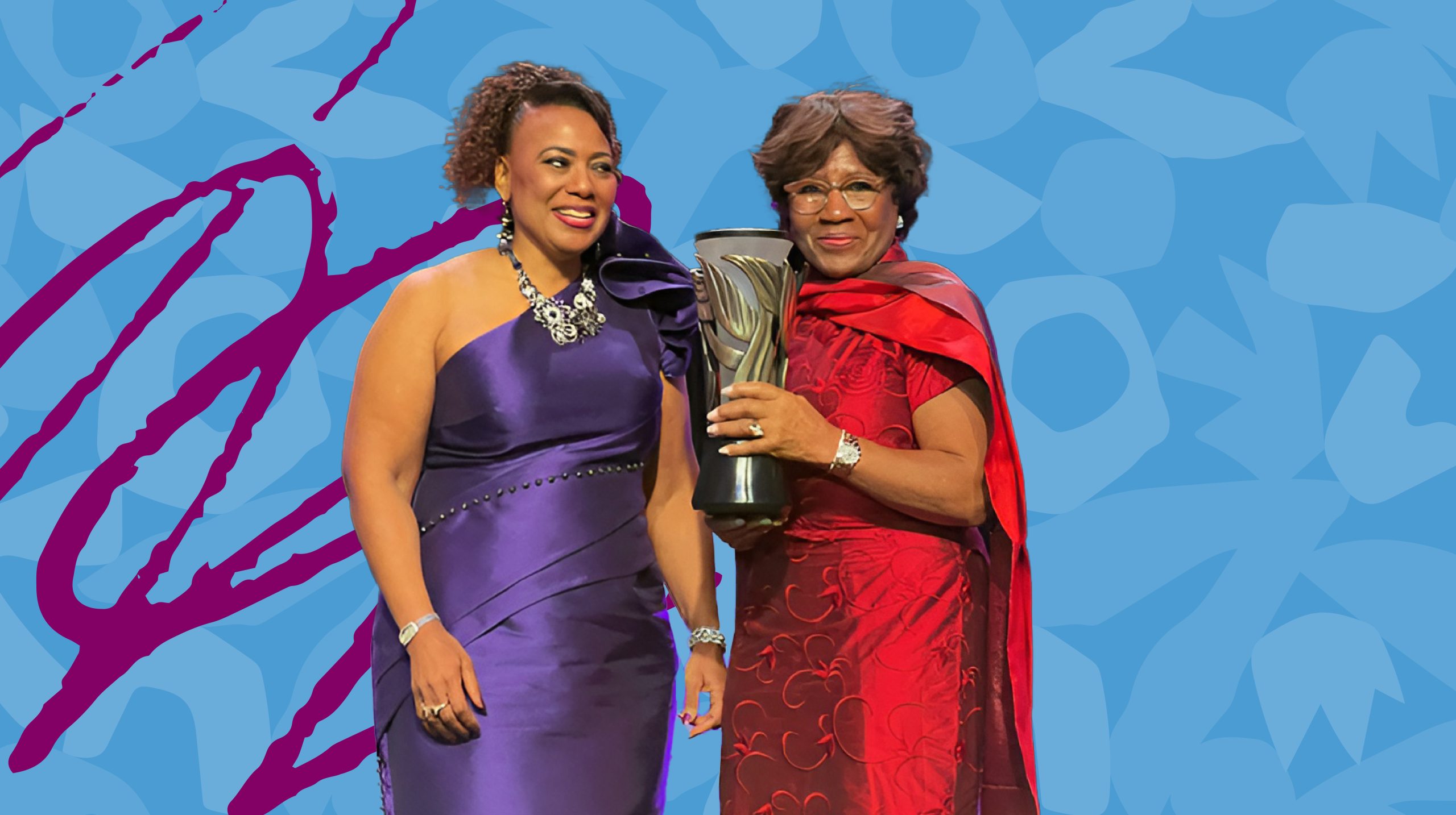 Dr. Bernice King in a purple dress standing next to Mrs. Deloris Jordan in a red dress against a Carolina Blue backdrop.
