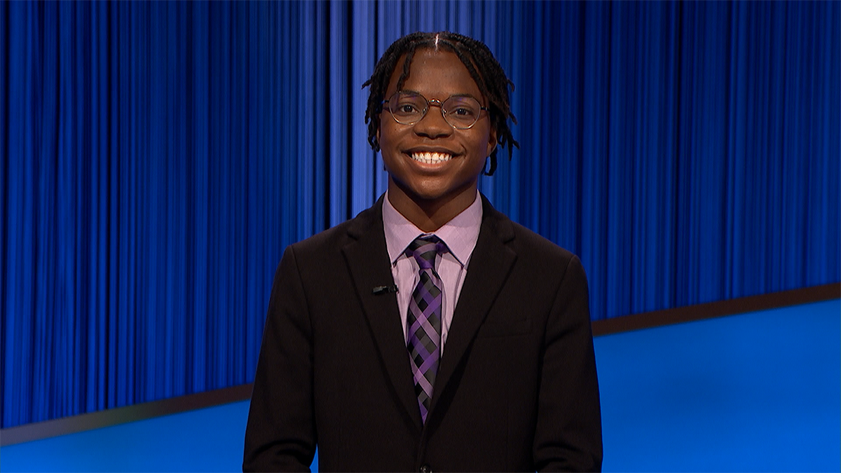 Rotimi Kukoyi smiling on the set of Jeopardy!