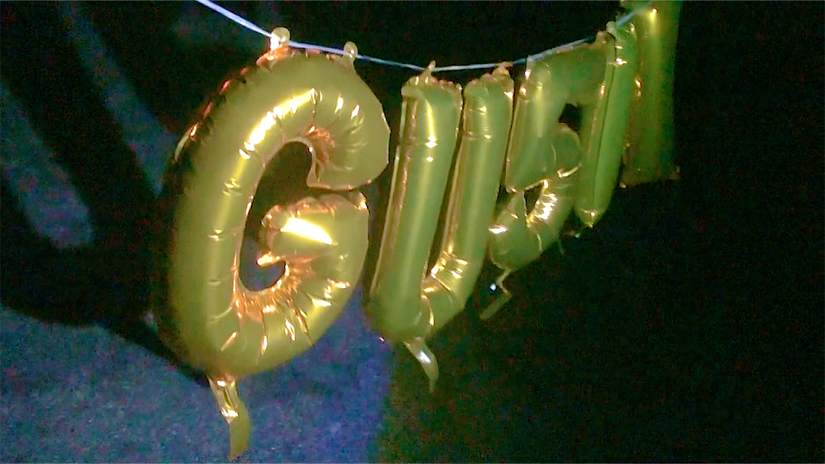 Gold balloons spelling out the word 