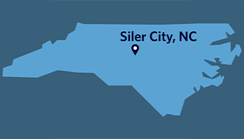 Map of North Carolina with a pin and text denoting the location of Siler City, N.C.