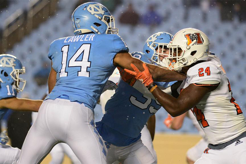 Jake Lawler playing defense during a college football game between UNC-Chapel Hill and Campbell University.